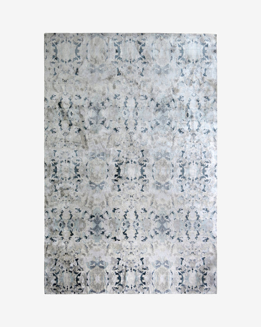 A Alabaster Hand Knotted Rug  Light with blue undertones and veined patterns on a white background