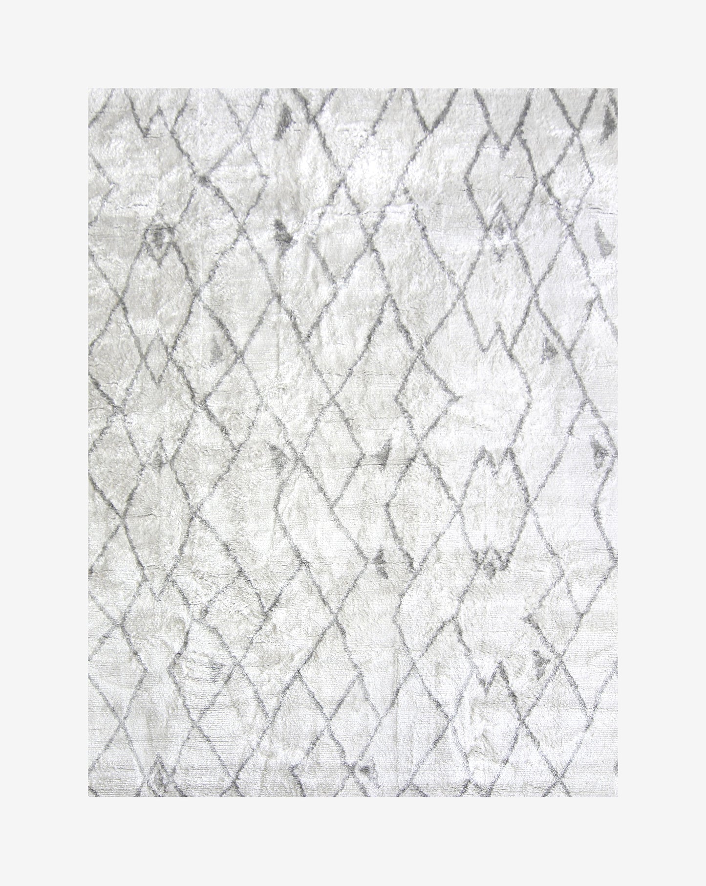 A white and gray Peaks Hand Knotted Rug Grey with a geometric design, hand-knotted composition, inspired by Shanan Campanaro