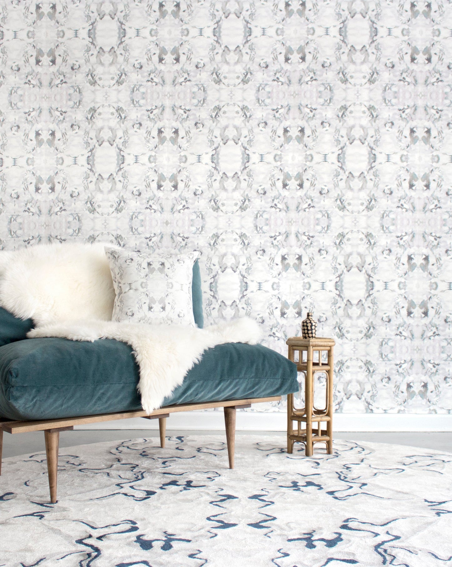 A living room with a Mallee Hand Knotted Rug Slate from the Eskayel Presidio Collection