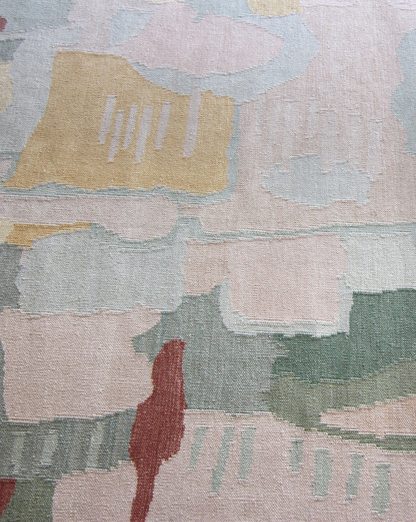 A close up of a Kotoubia Flatweave Rug Karmouss with abstract designs on it