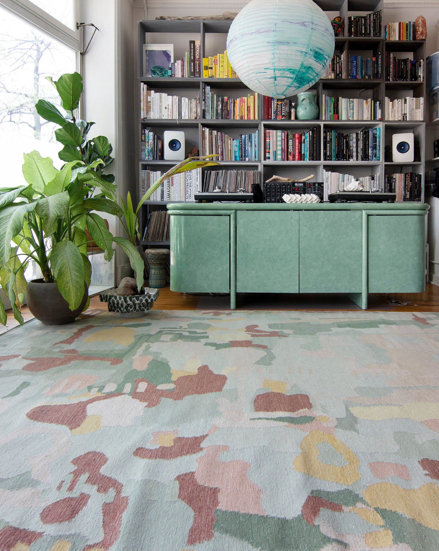A room with bookshelves and a Kotoubia Flatweave Rug Karmouss