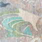 A close-up of the Clairmont Hand Knotted Rug in Stucco from the Presidio Collection by Eskayel with a colorful design