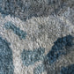 A close-up of a luxury Diego Hand Knotted Rug Slate from Eskayel's Presidio Collection