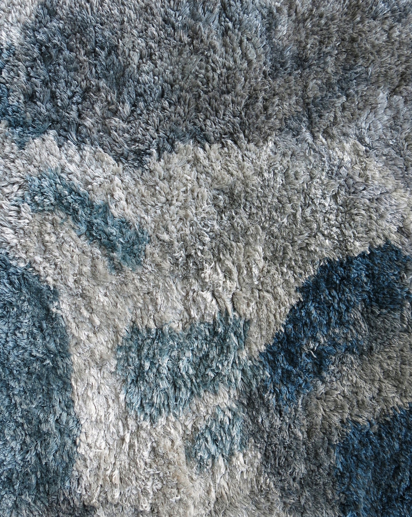 A close-up of a luxury Diego Hand Knotted Rug Slate from Eskayel's Presidio Collection