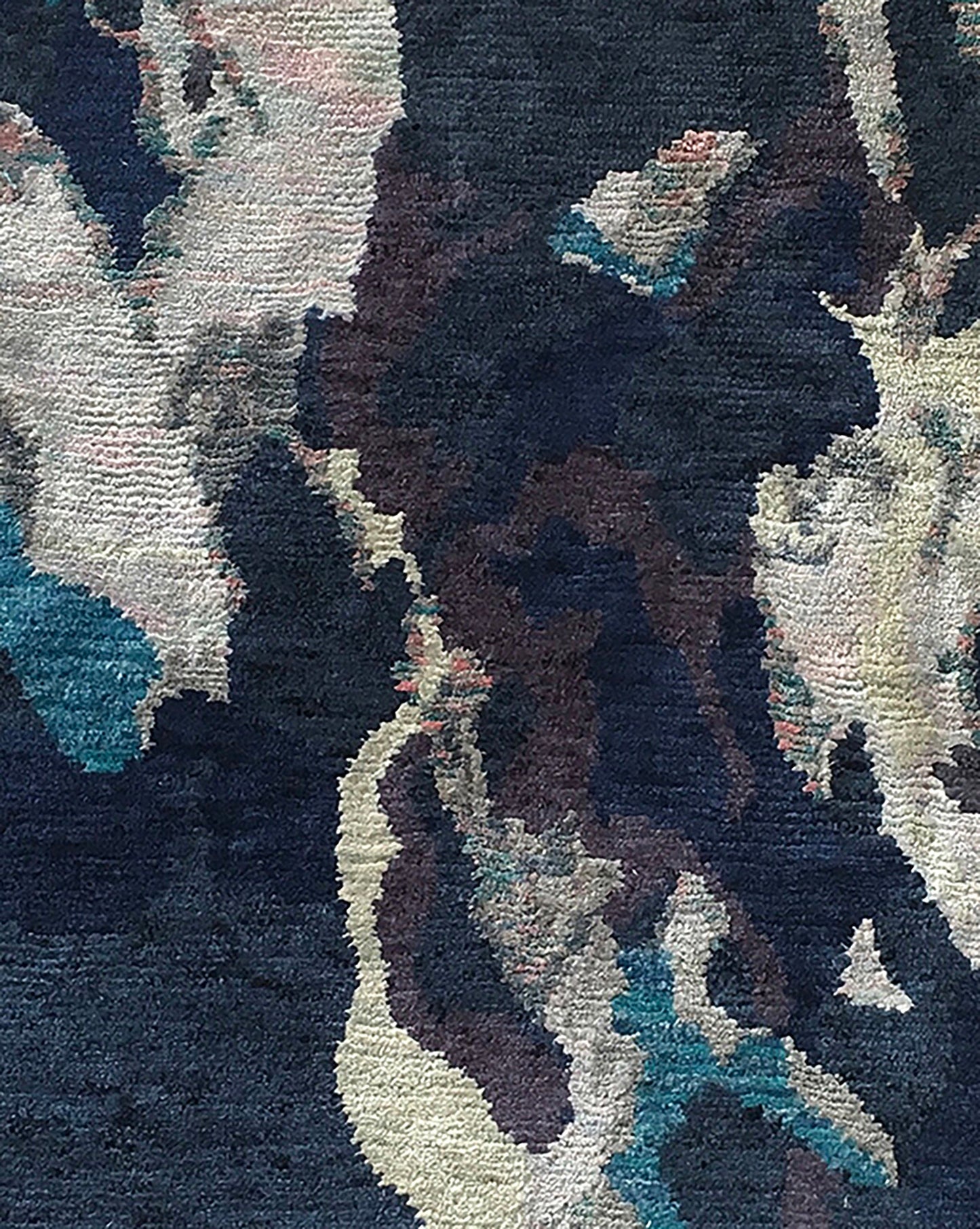 A close up of a Huerfano Hand Knotted Rug Navy from the Presidio Collection