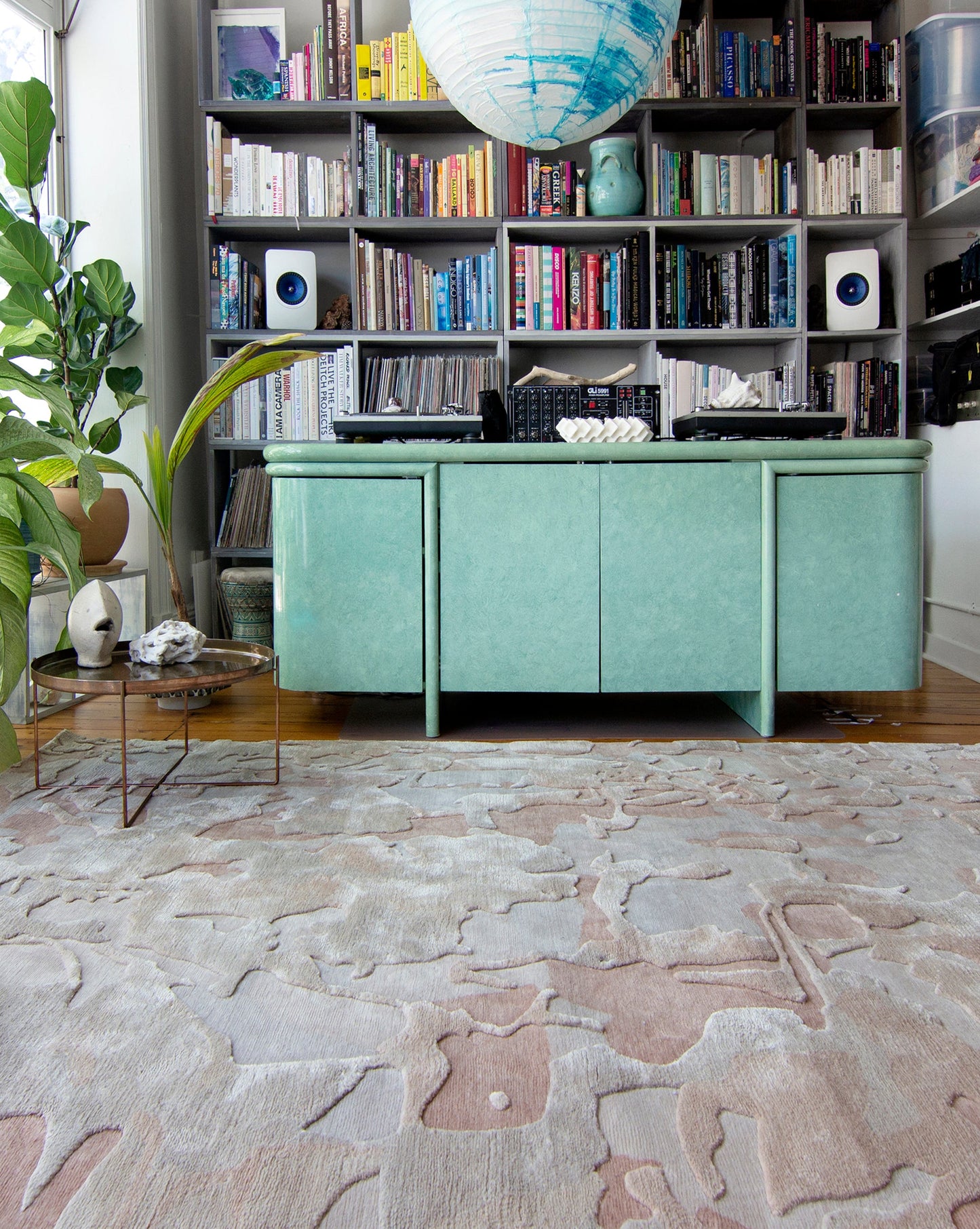 A living room with a Kotoubia Hand Knotted Rug