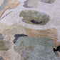 A close up of a Medina Hand Knotted Rug with abstract designs on it