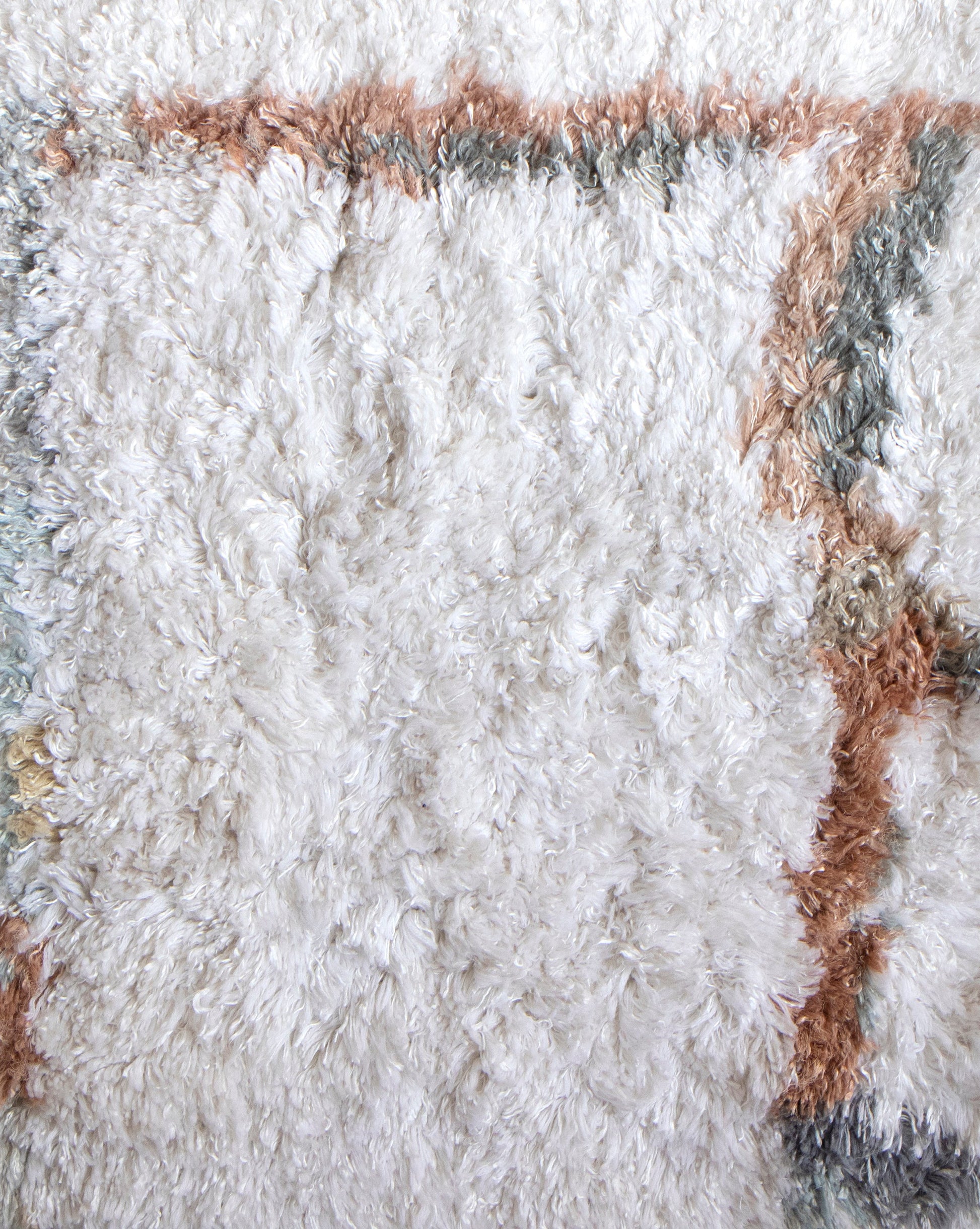 A close up of a white and brown Portico Hand Knotted Rug Sol by Eskayel studio