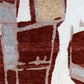 A red, beige, and brown Quotidiana Hand Knotted Rug Burnt Sienna with abstract shapes on it