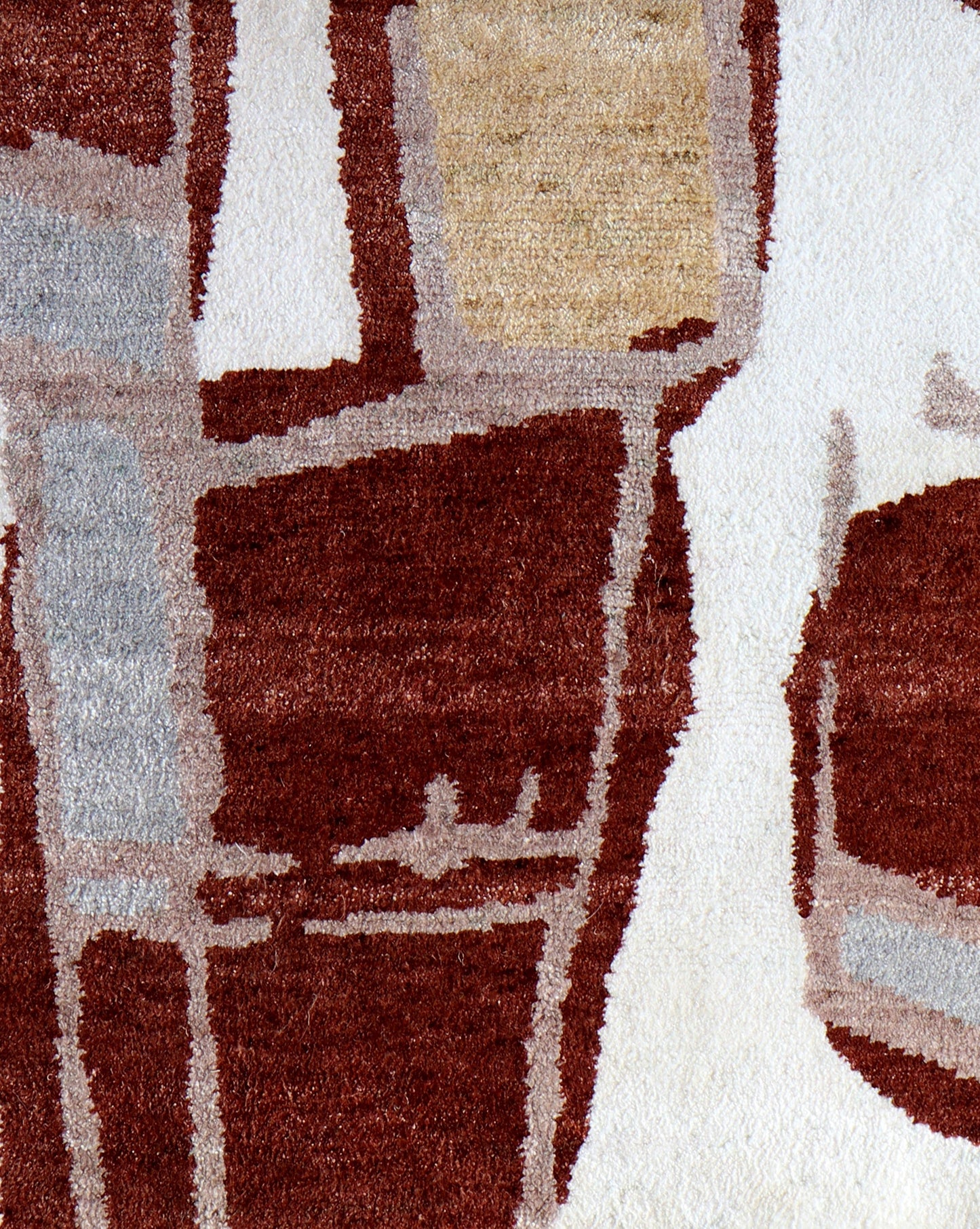 A red, beige, and brown Quotidiana Hand Knotted Rug Burnt Sienna with abstract shapes on it