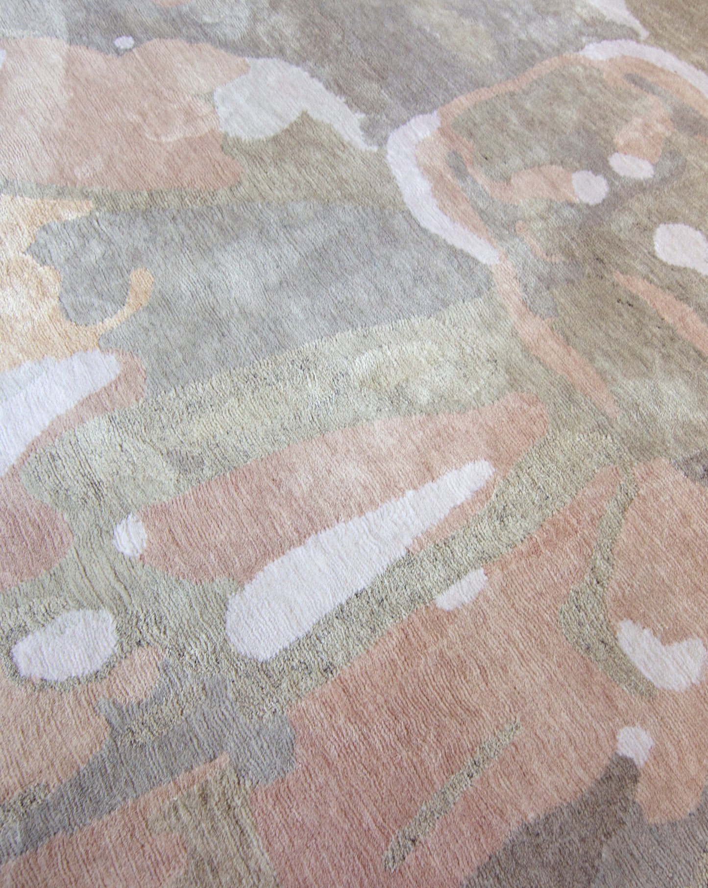 A Tamandot Hand Knotted Rug Lumier with an abstract design on it