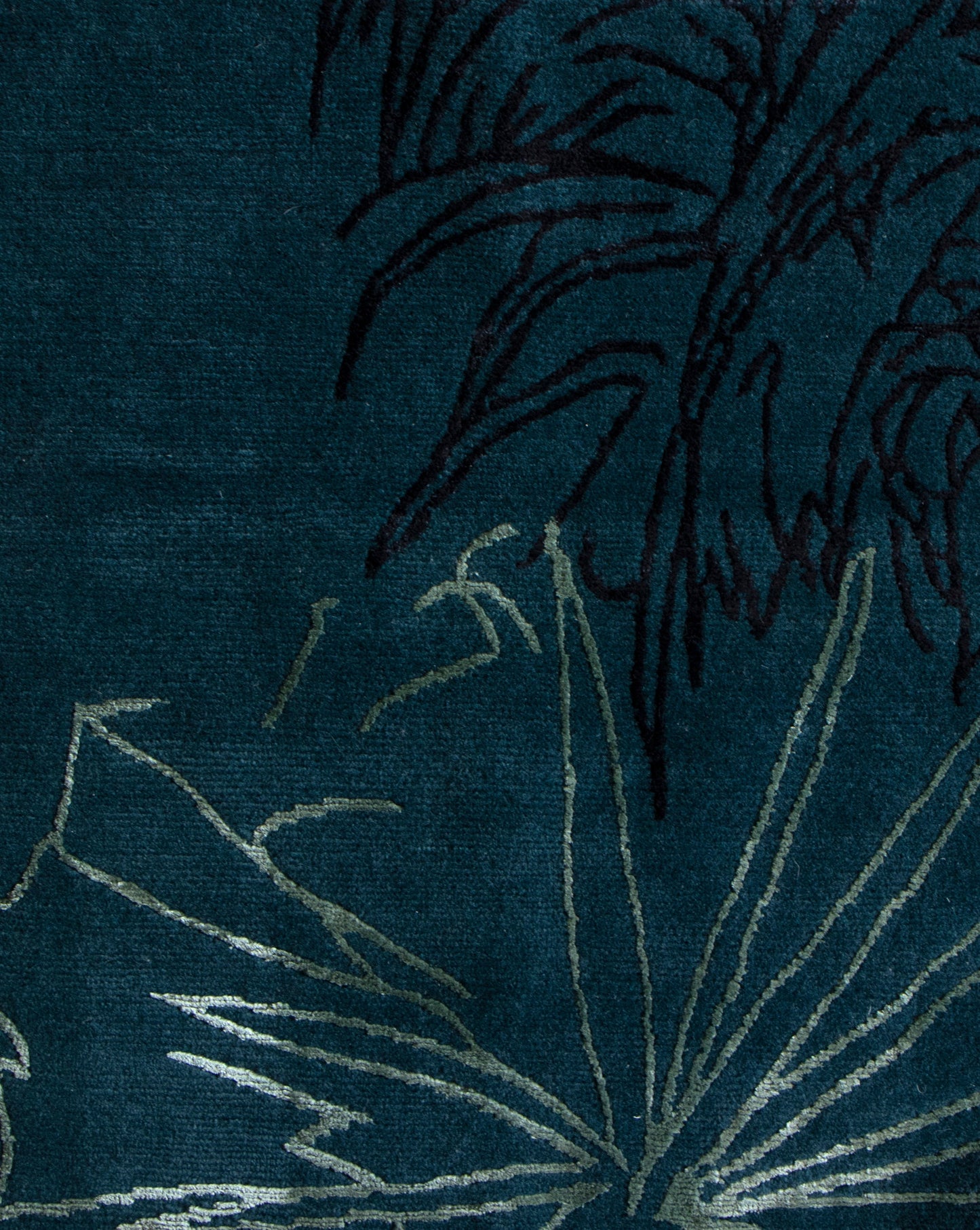 A botanical drawing of a palm tree on a blue background from the Through The Grove Hand Knotted Rug Azure