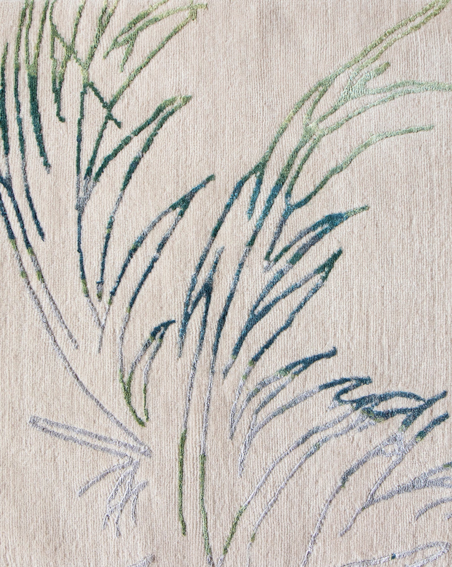 A close up of an embroidered Through The Grove Hand Knotted Rug Neutral from the modern botanical Salentu Collection
