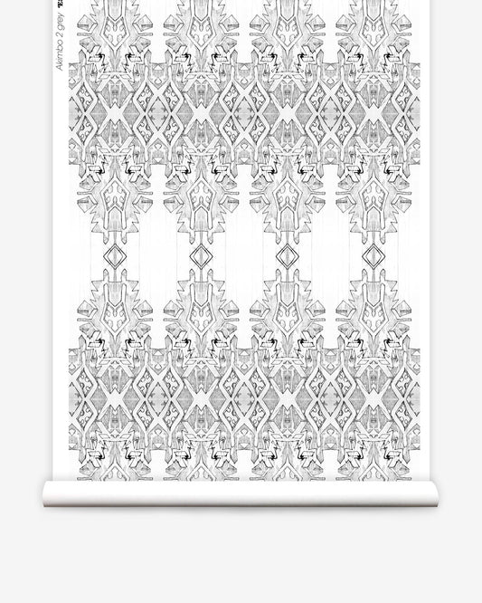 A roll of Akimbo 2 Wallpaper Greyscale, with a monochrome pattern on it, lying akimbo