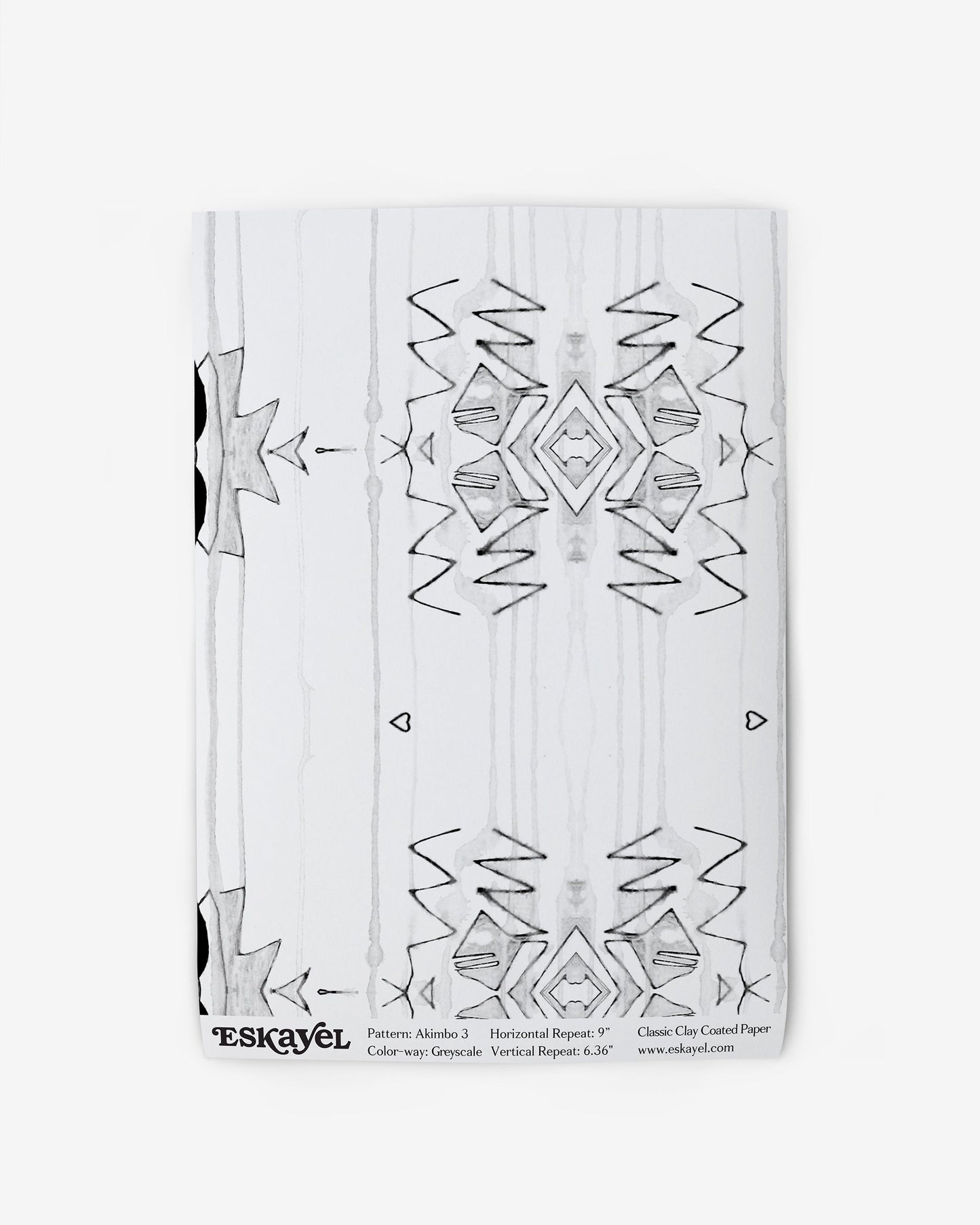 A notebook with an Akimbo 3 Wallpaper Greyscale design on it