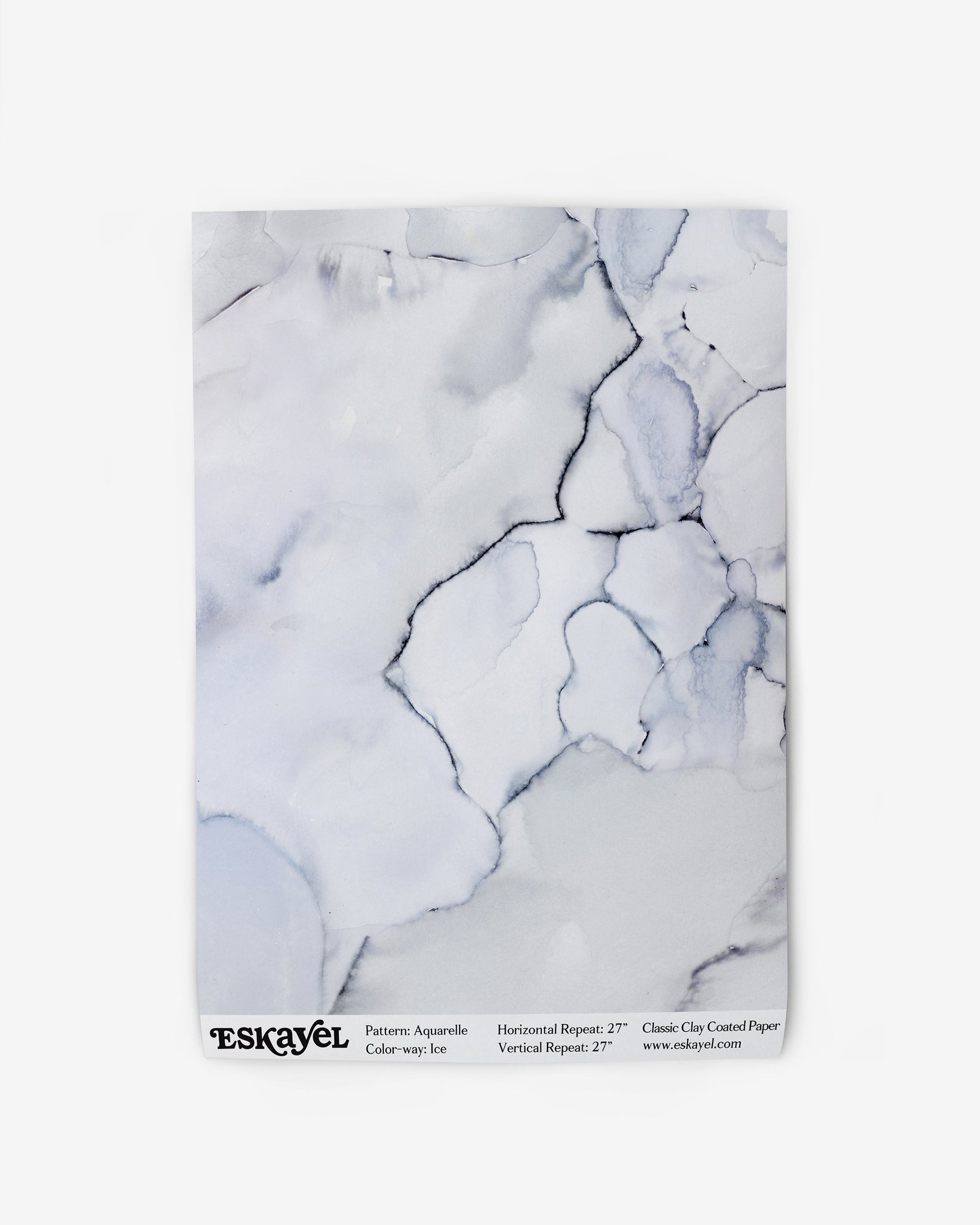 A magazine with an Aquarelle Wallpaper Ice cover that exudes a high-end and luxurious ambiance