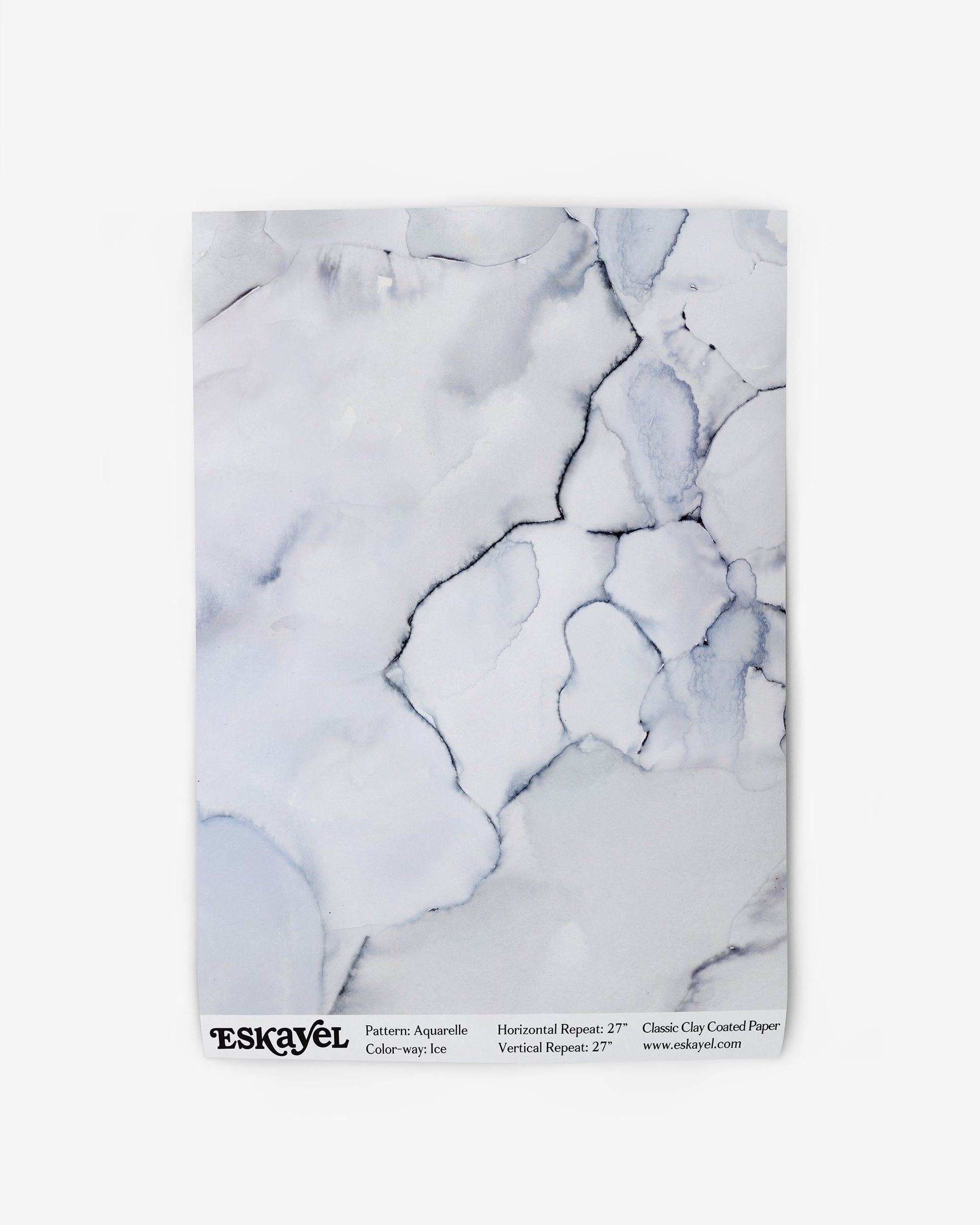 A magazine with an Aquarelle Wallpaper Ice cover that exudes a high-end and luxurious ambiance