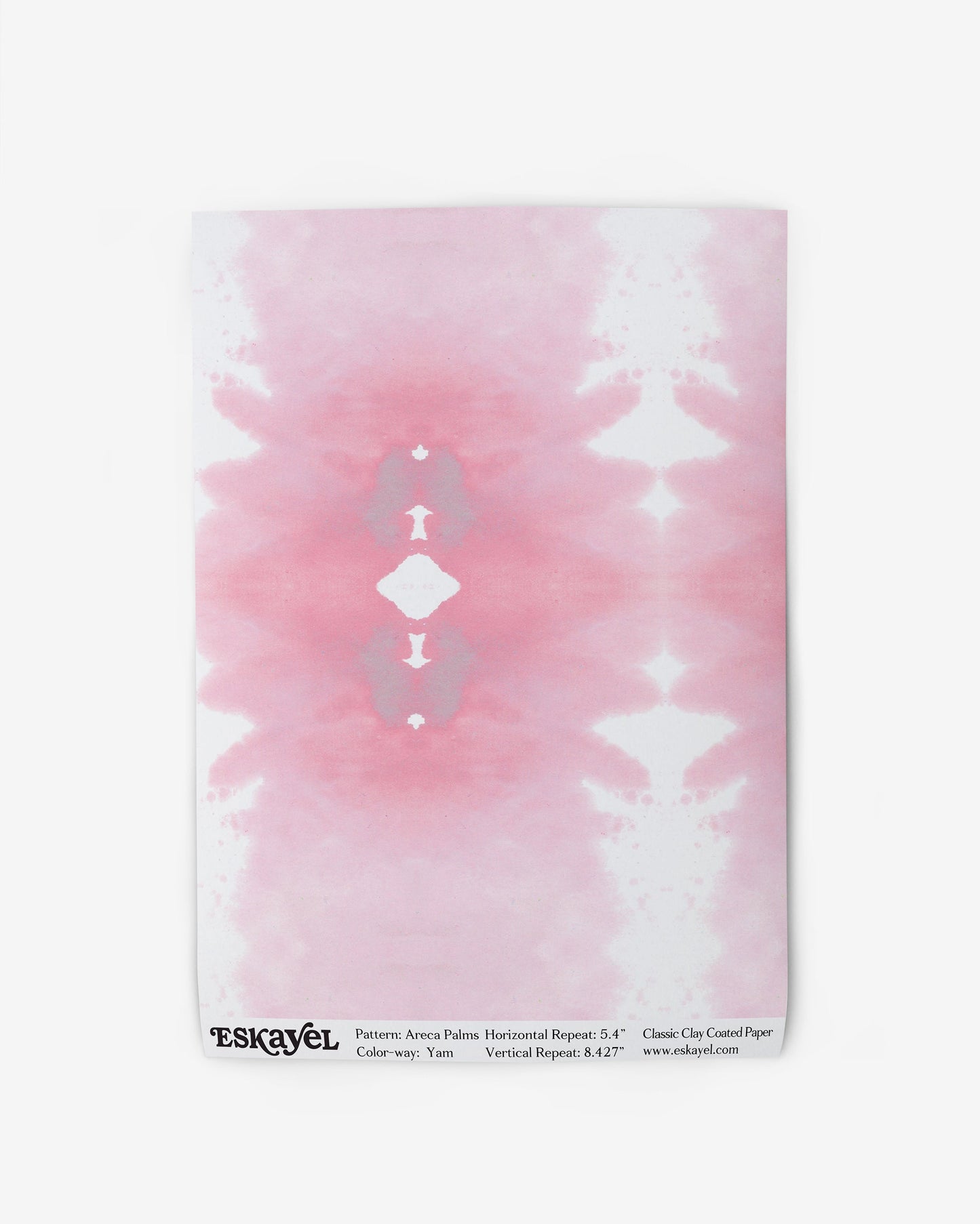 A pink and white tie dye pattern with pink hues on wallpaper called Areca Palms on wallpaper