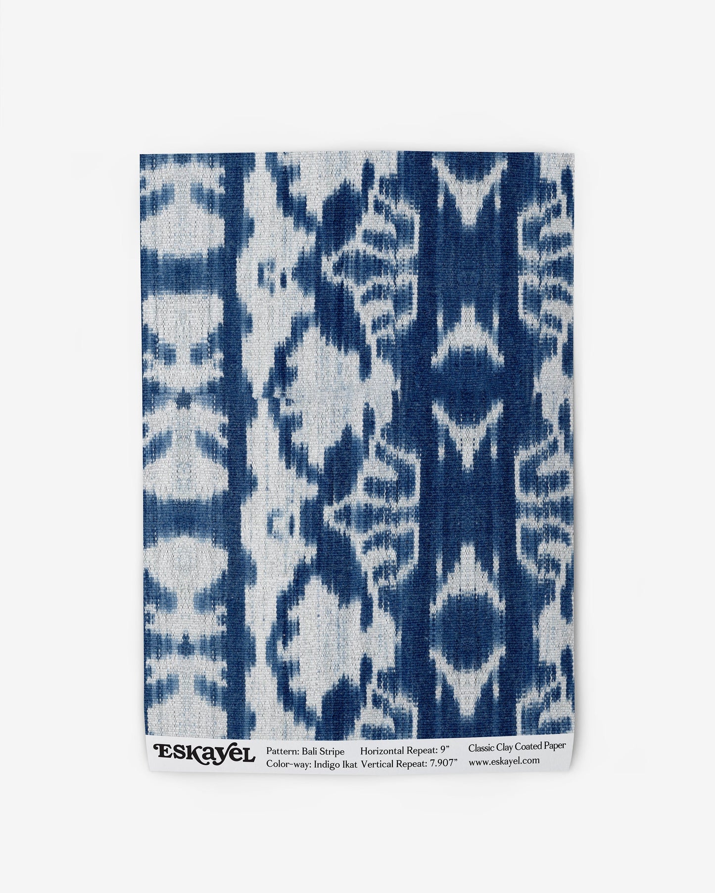 A blue and white Bali Stripe Wallpaper Indigo Ikat print on wallpaper