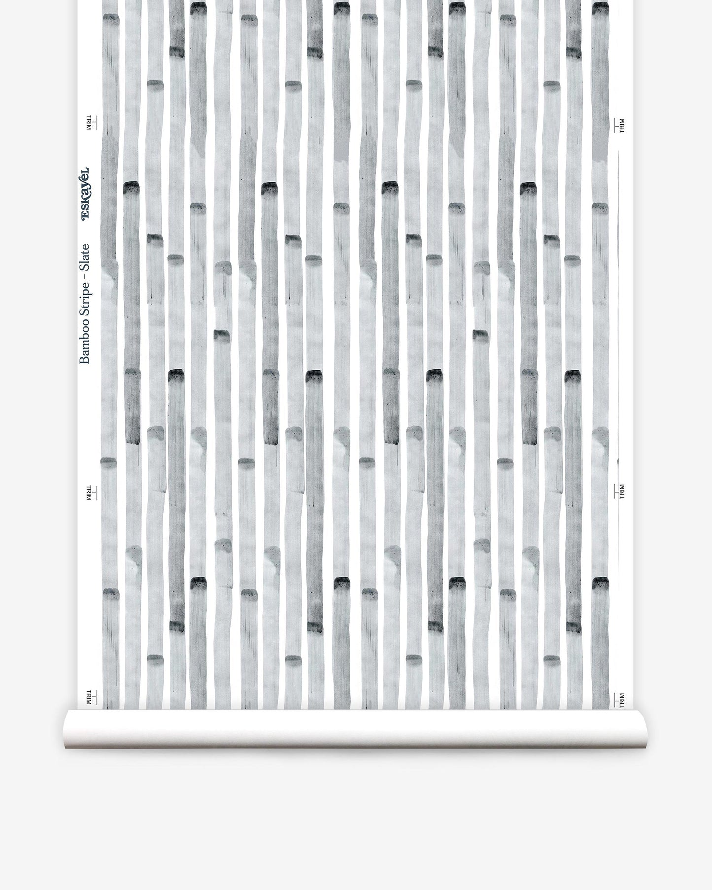 A roll of Bamboo Stripe Wallpaper Slate from Eskayel's high-end Bamboo Stripe range with a black and white pattern on it