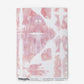 A pink and white Banda Wallpaper Persimmon pattern on wallpaper