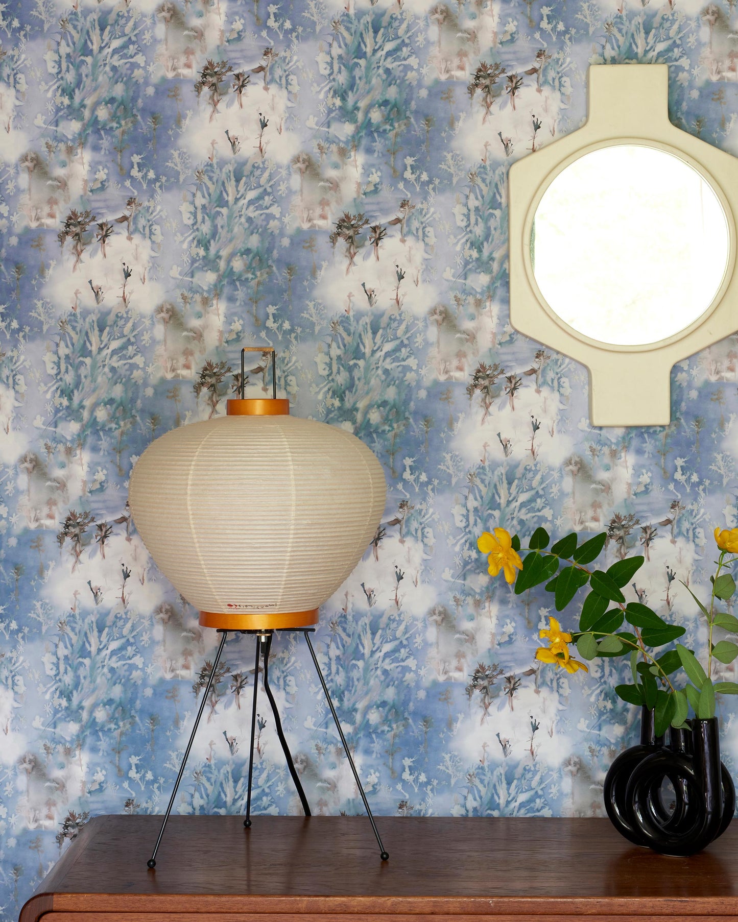 A Emvasia Wallpaper Thalassa on a table next to a mirror