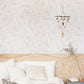A bedroom with a white bed and a wooden headboard in the Canadian Pacific Northwest decorated with Kalos Wallpaper Cameo
