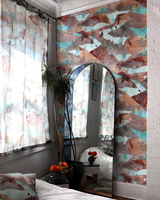 A bedroom with a Mani Wallpaper Morea and a mirror, inspired by the colorways of Greece