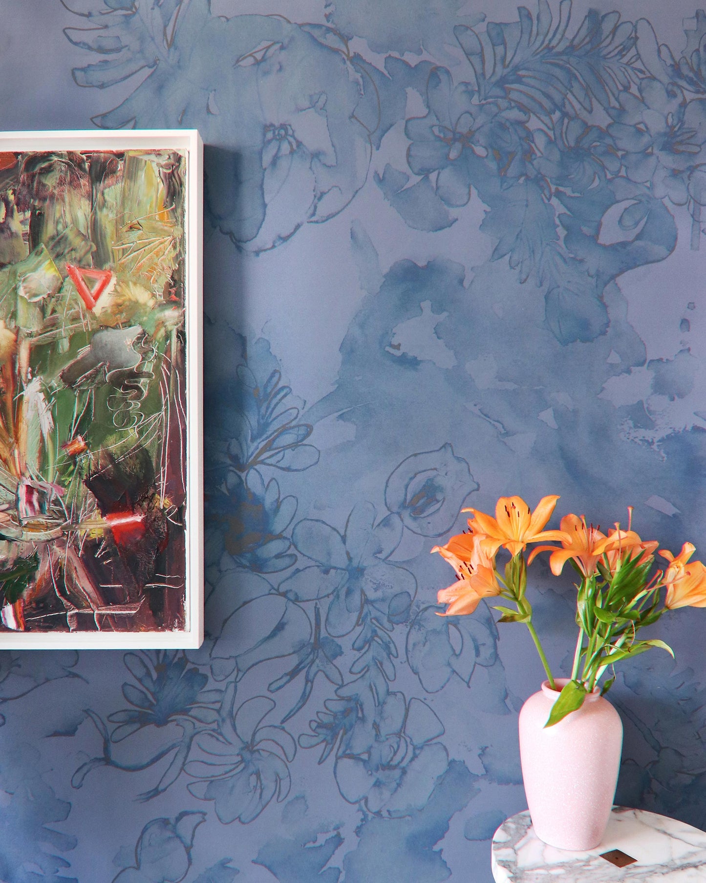 A vase of orange flowers on a table next to Belize Blooms Wallpaper Night Fog