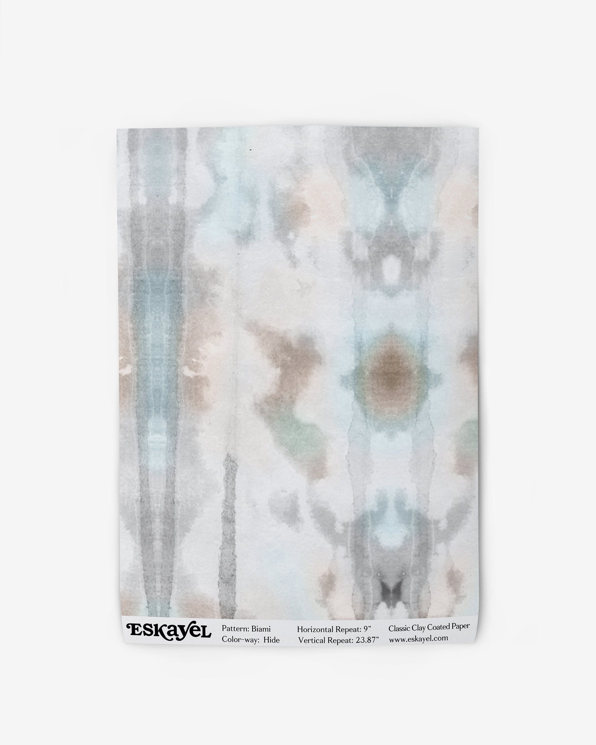 A soft white Biami Wallpaper Hide patterned with a blue and white tie dye design