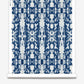 A Biami Wallwallpaper Indigo Ikat with a blue and white ikat pattern on a roll of wallpaper