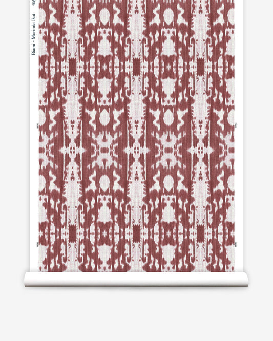 A red and white Morinda Ikat pattern on wallpaper of luxury fabric