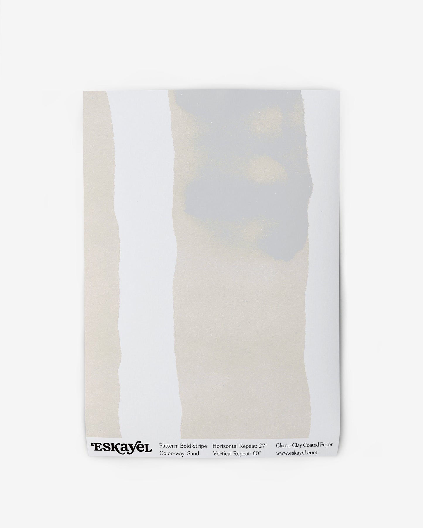 A book with a white cover and a grey stripe on its cover, reminiscent of the Bold Stripe Wallpaper Sand