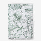 A luxury fabric with a green and white Bosky Toile Wallpaper drawing on it