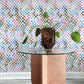 A table with a potted plant in front of a Chess Wallpaper Multi high-end checkerboard pattern