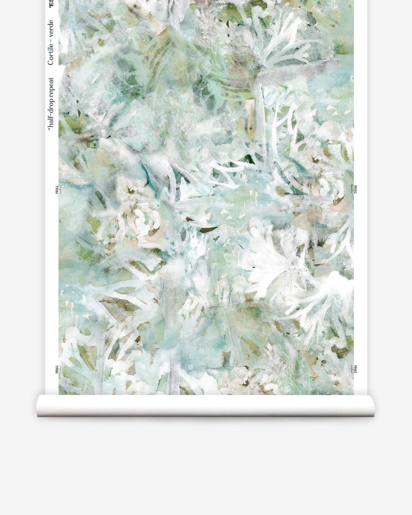 A white and green floral Cortile Wallpaper and Verde custom wallpaper on a roll