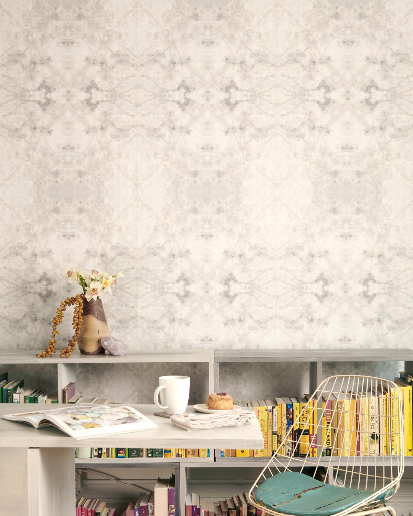 A room with a desk, chair and The Drama Wallpaper Cloud bookshelf