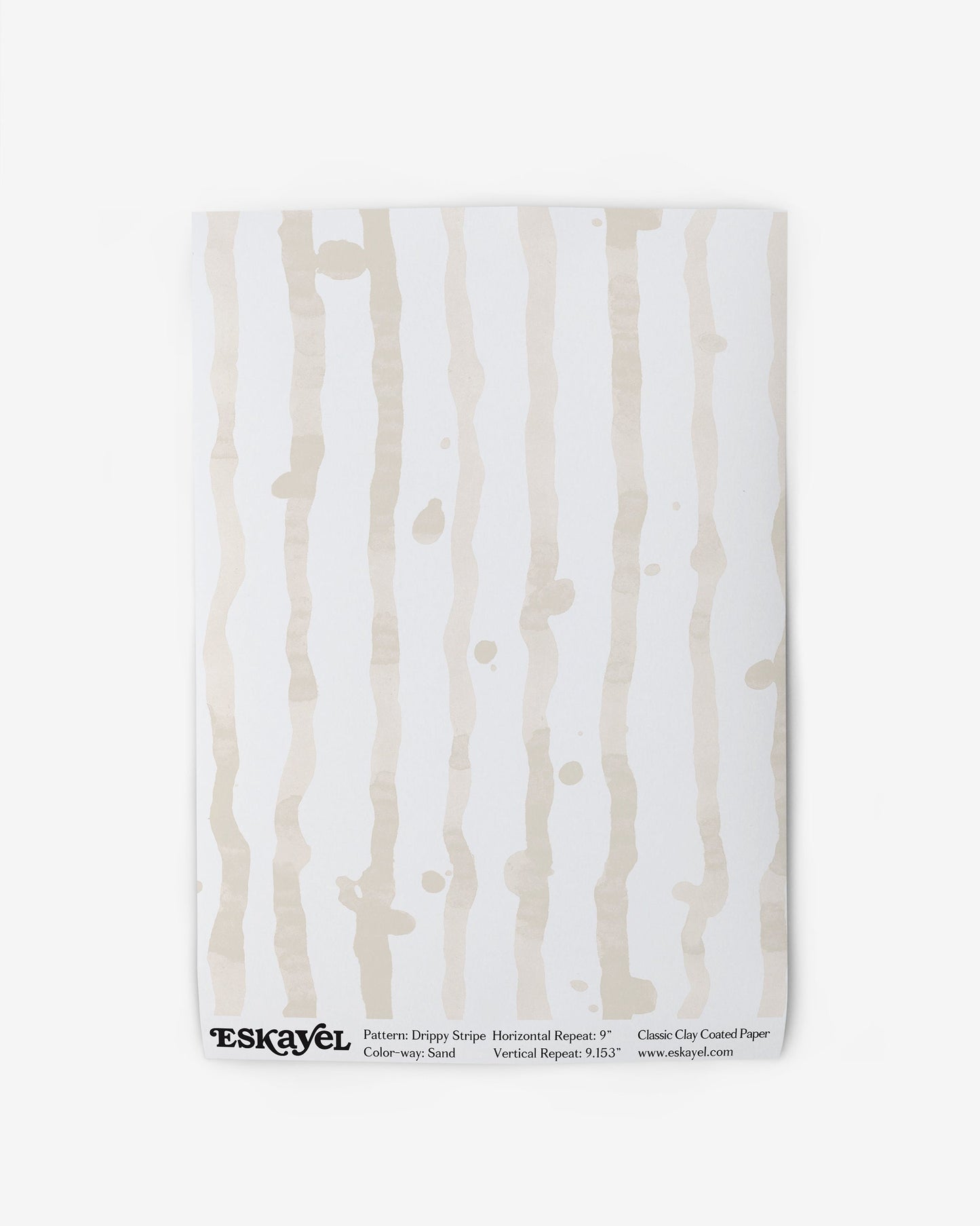 A white Eskayel Drippy Stripe Wallpaper with a beige and white stripe pattern