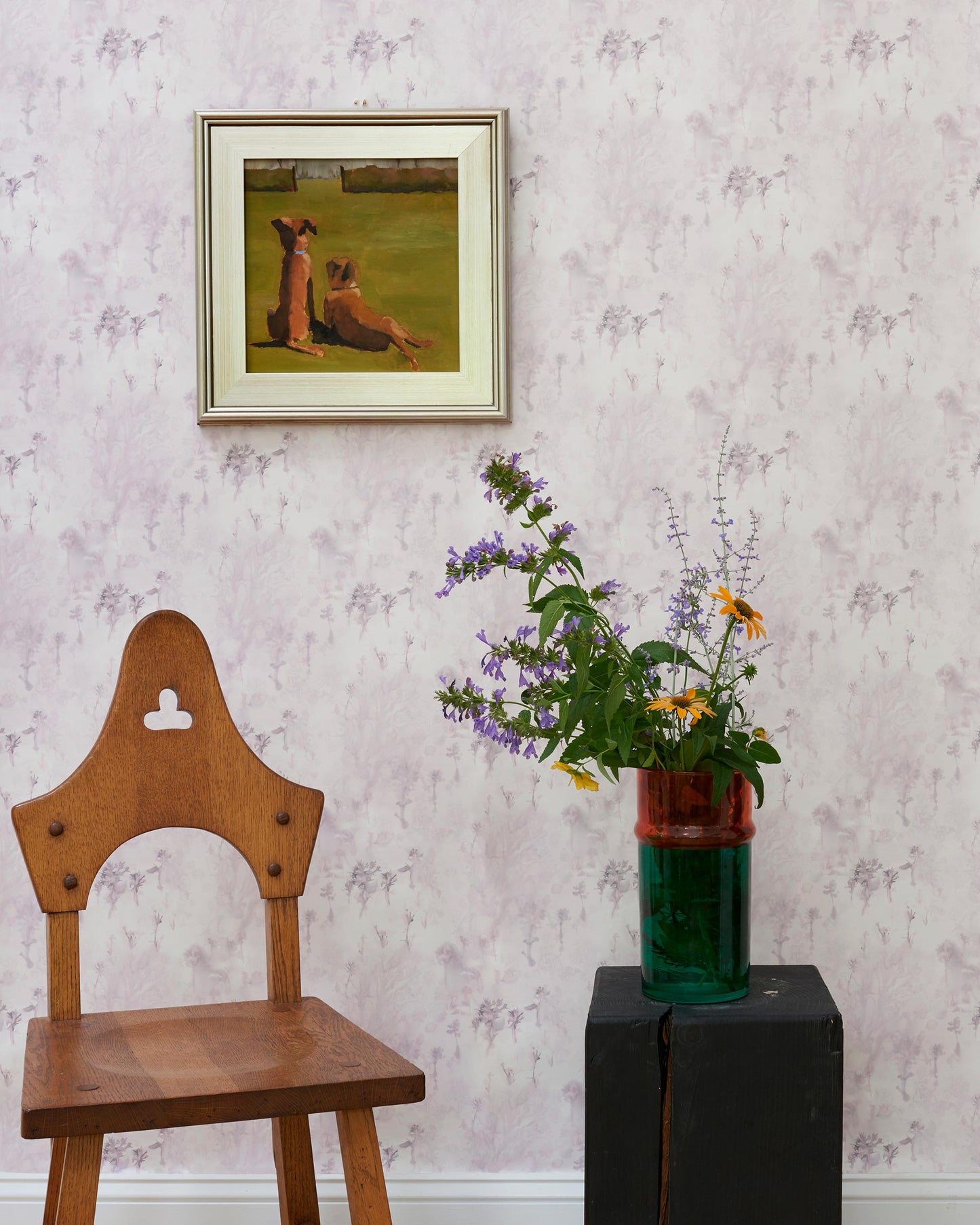 A wooden chair in front of an Emvasia Wallpaper||Alba landscape.