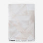 A white geometric patterned Kalos Wallpaper Cameo wallpaper