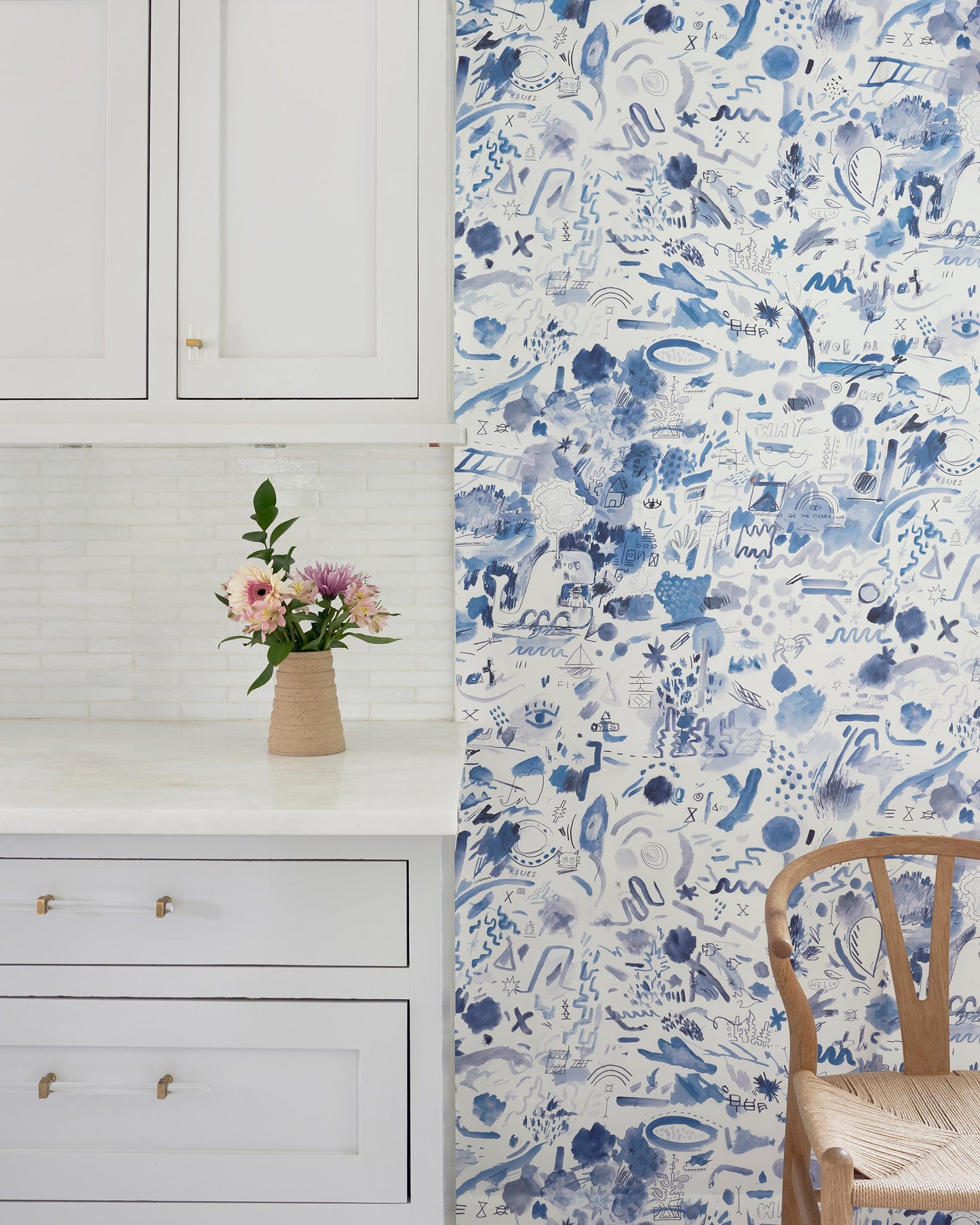 A blue and white floral Nuit Wallpaper in a kitchen