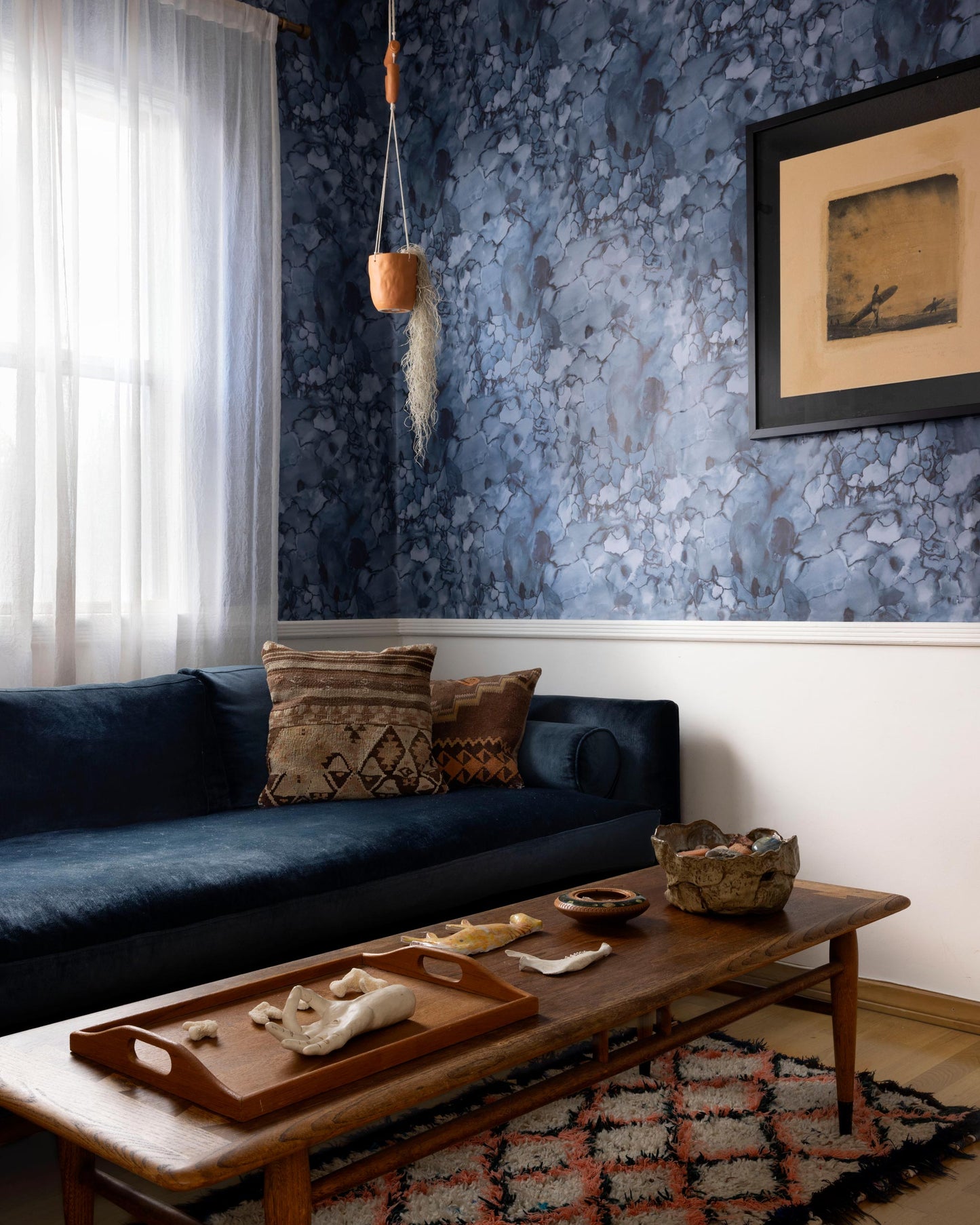 A luxury Aquarelle Wallpaper Ocean couch in a living room
