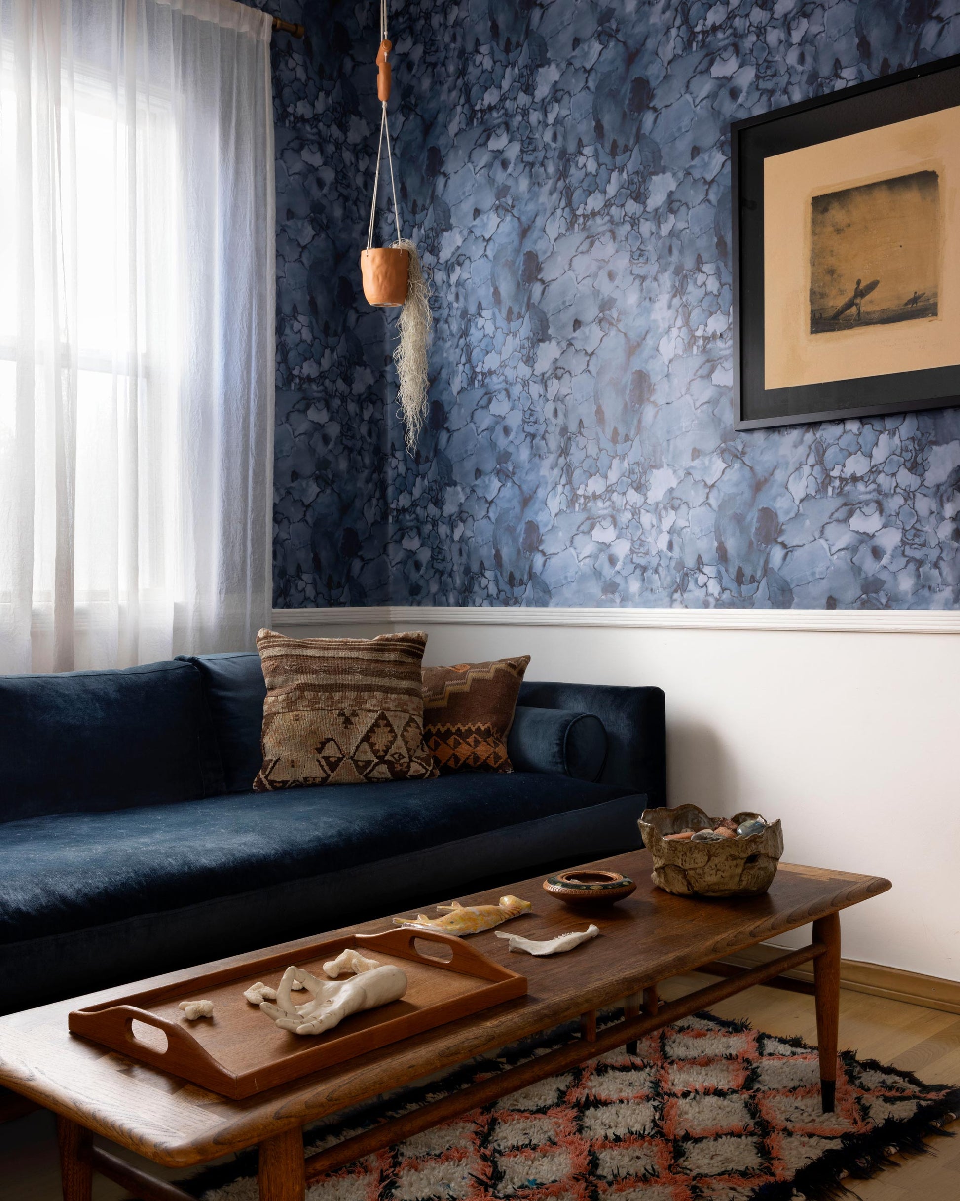 A luxury Aquarelle Wallpaper Ocean couch in a living room