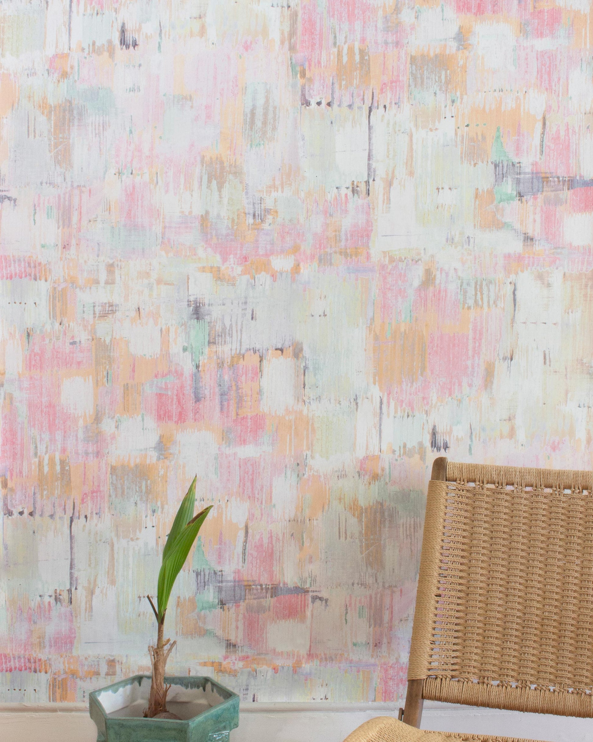 A chair sits in front of a high-end Cherifia Wallpaper Karmouss pattern wallpaper