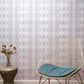 A luxurious Icelandic Mist Wallpaper sits in front of a Sea Green chair