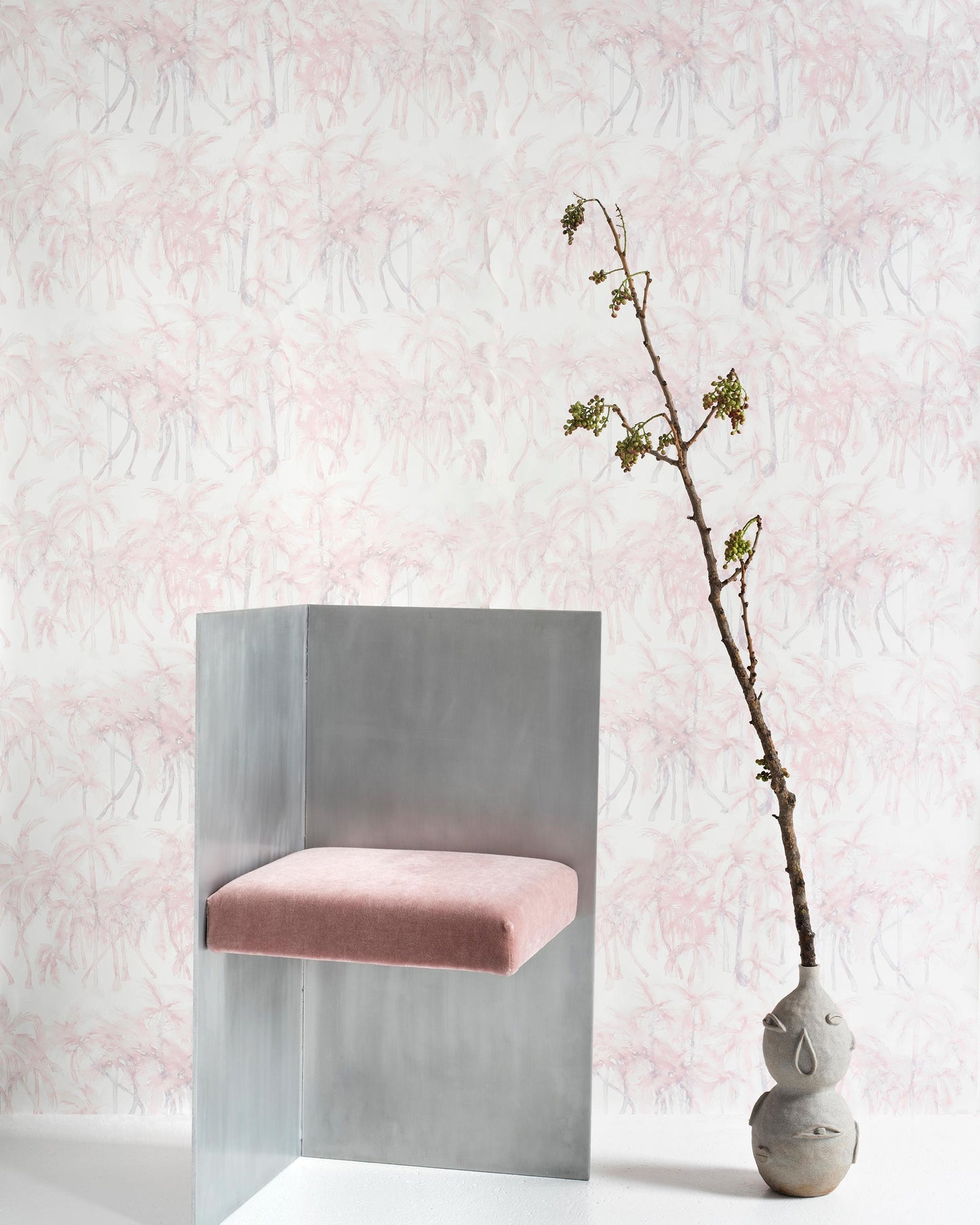 A pink chair sits in front of Palm Dance Wallpaper Coral