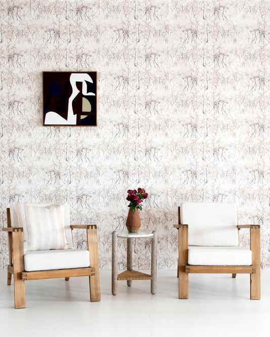 Two white Palm Dance Wallpaper Sand chairs in front of Costa Rica's Playa Hermosa, creating a luxurious and elegant ambiance