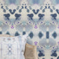 A blue and white Species Wallpaper Waterstone kaleidoscopic effect in front of a chair