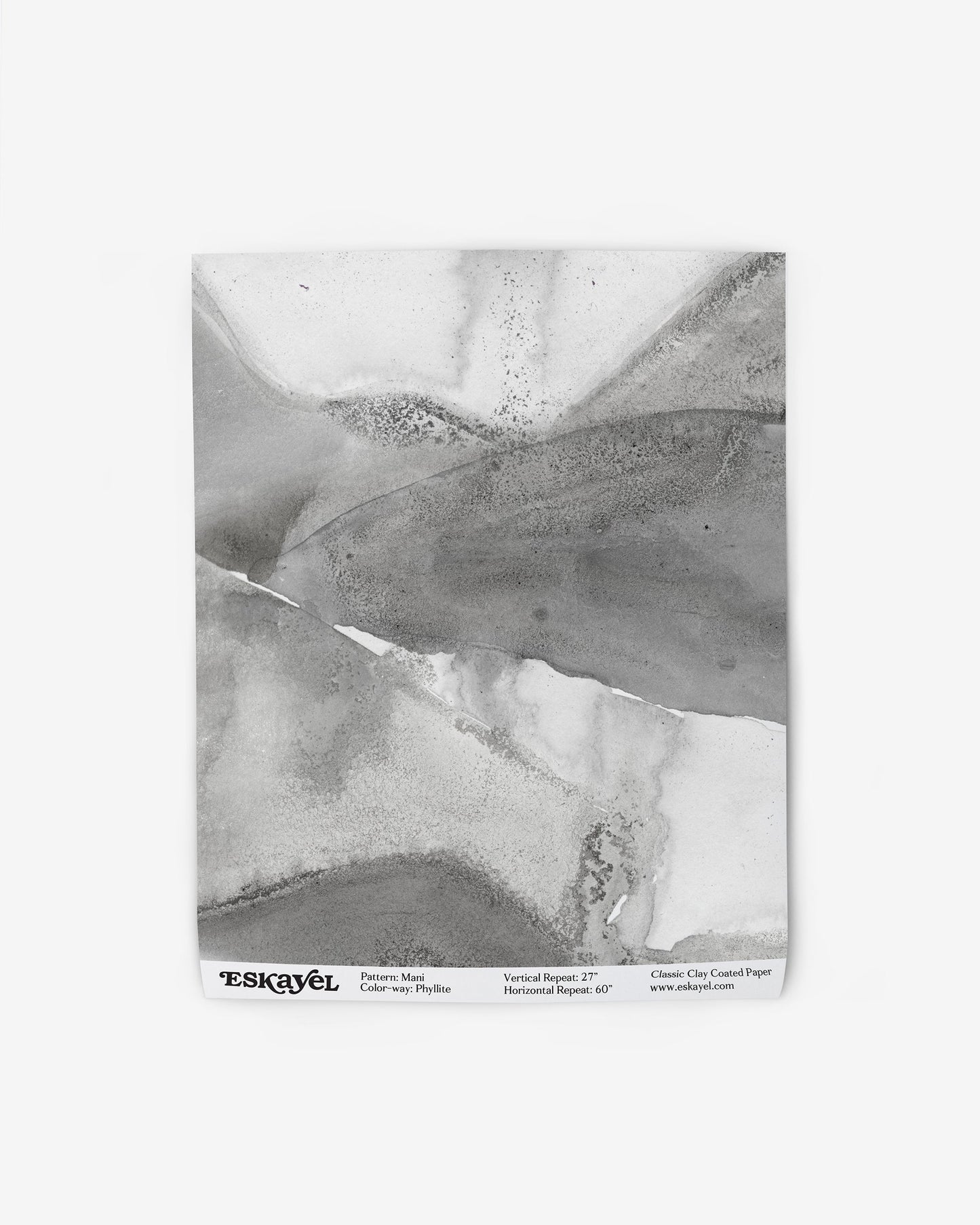 A black and white piece of art on a Mani Wallpaper Phyllite surface