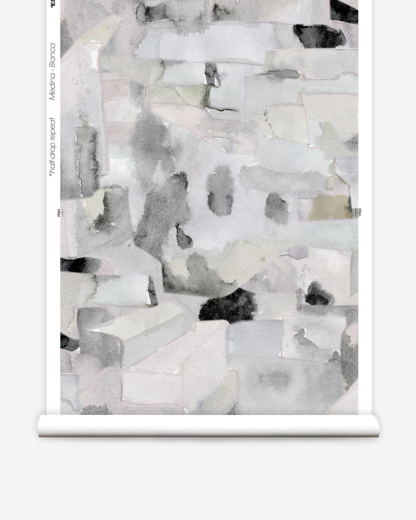 A roll of wallpaper with a black and white painting on it can be used as Medina Wallwallpaper Blanca